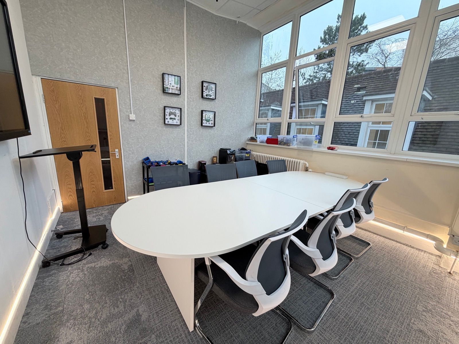 The multi-function Board Room set up with laptops and a conference table