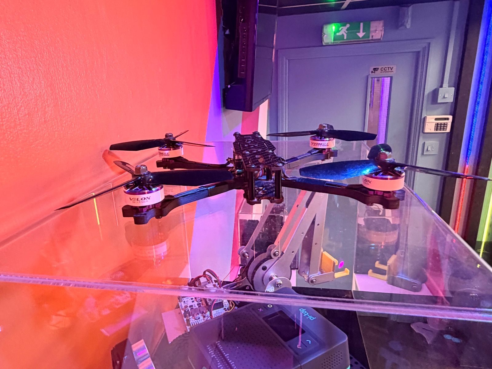 A drone in a display case on the feature wall