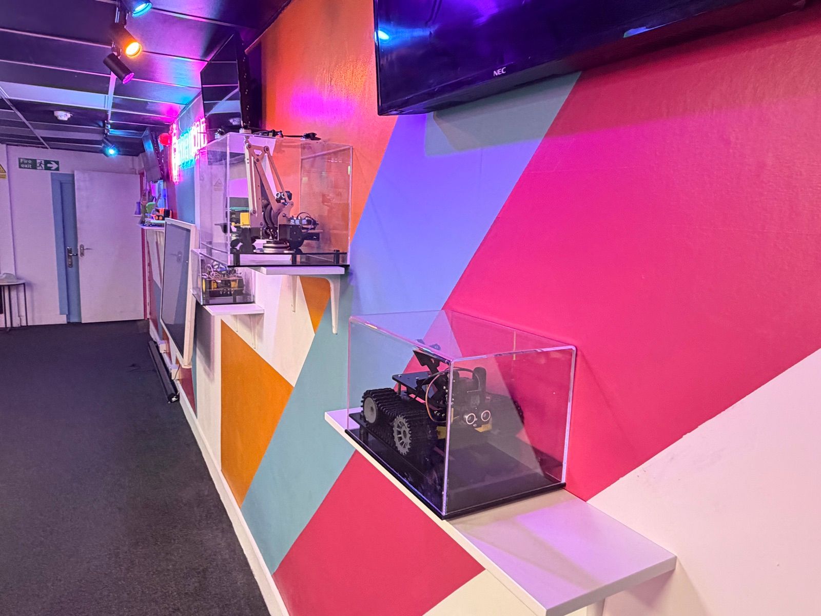Display cases of Robocoders' builds along the feature wall