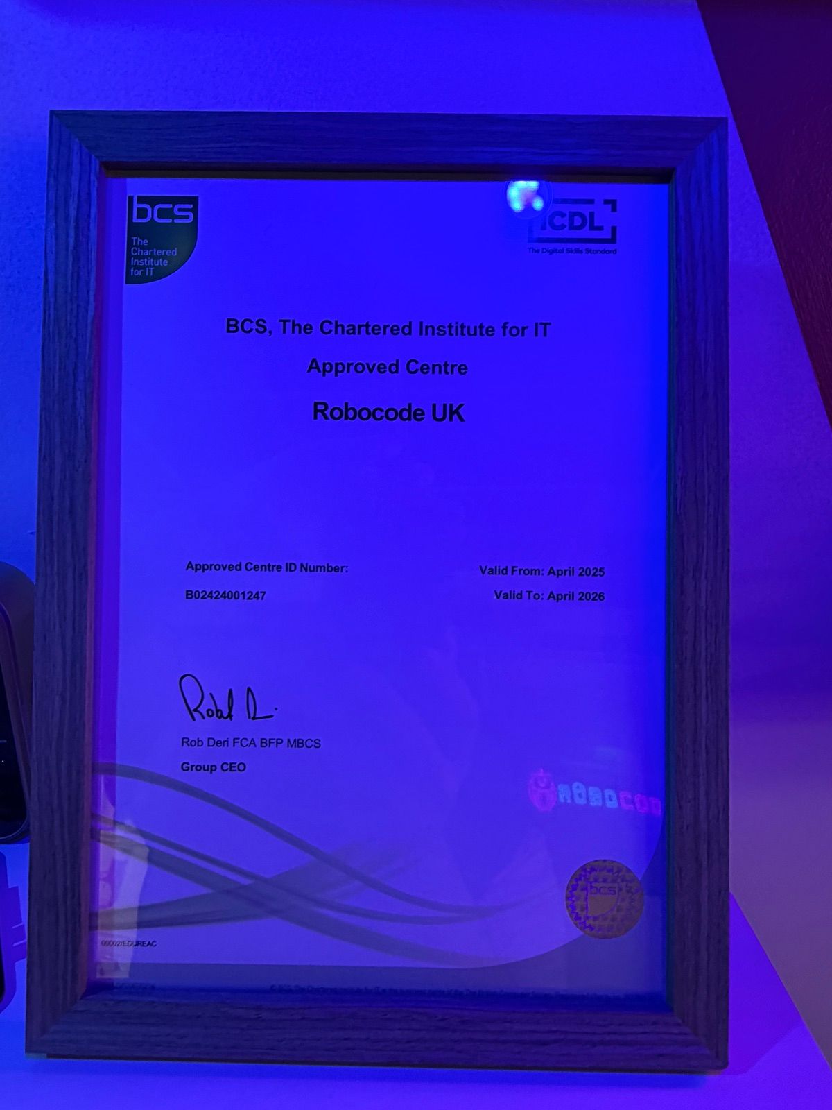 A framed BCS accreditation certificate on the wall of a Robocode centre