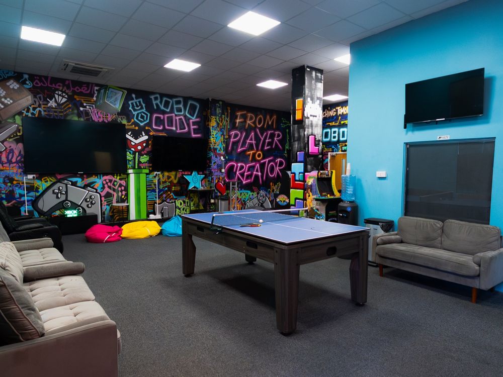 The social space with a pool table and graffiti wall