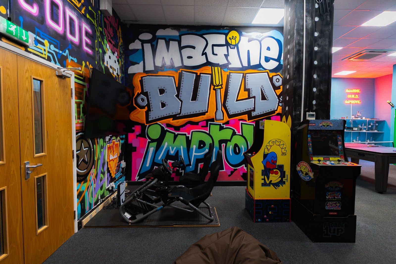 The graffiti wall in a Robocode centre: Imagine, Build, Improve