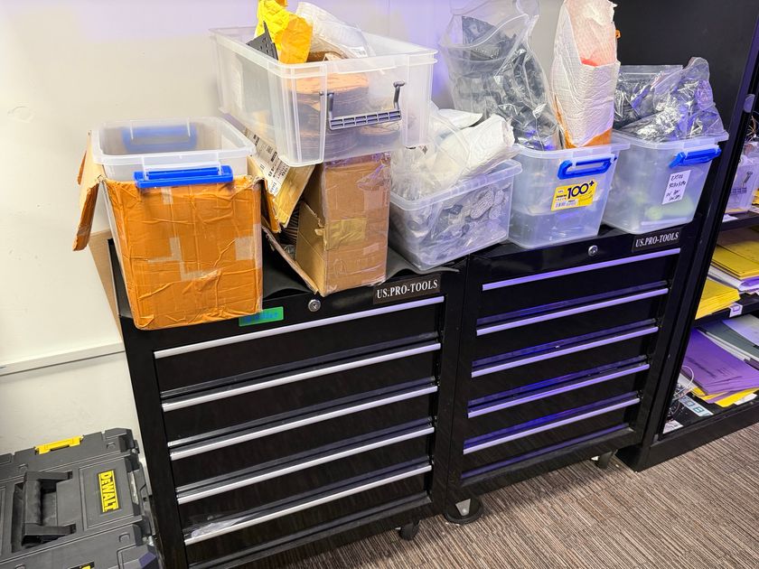 The storage room with labelled component bins and shelving
