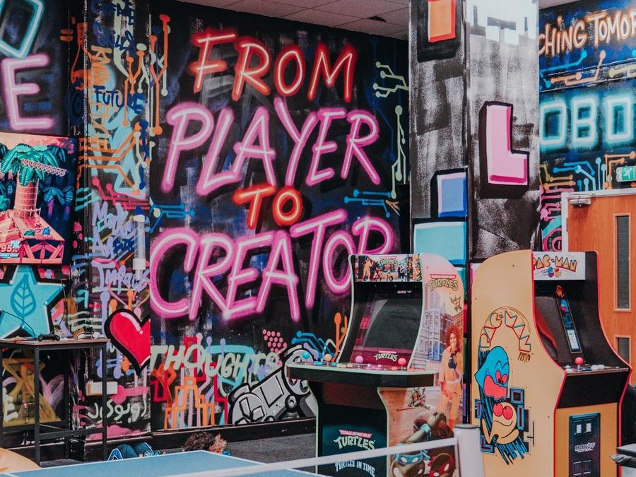 The arcade and graffiti wall inside a Robocode centre