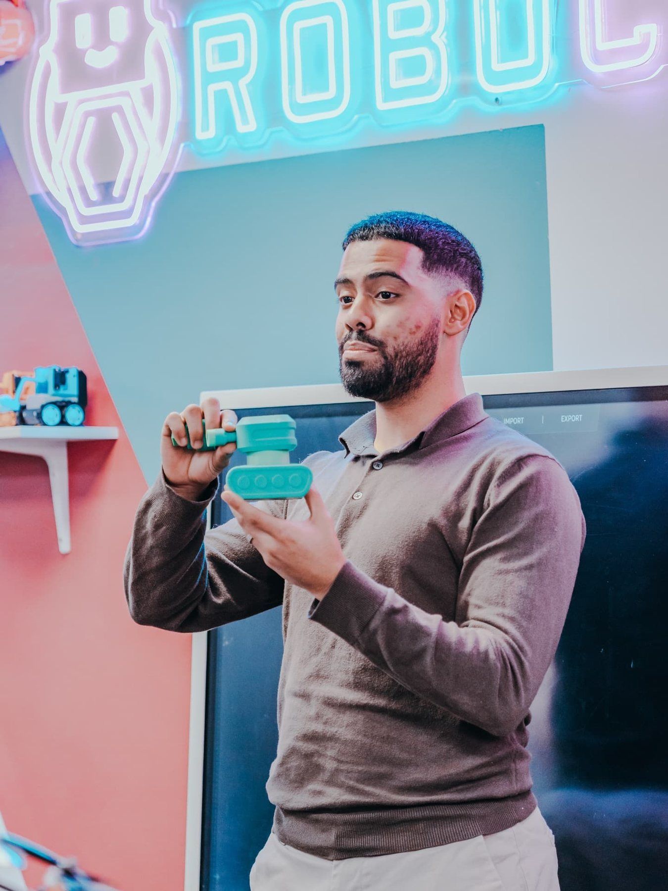 A Mentor showing a part fresh from the 3D printer