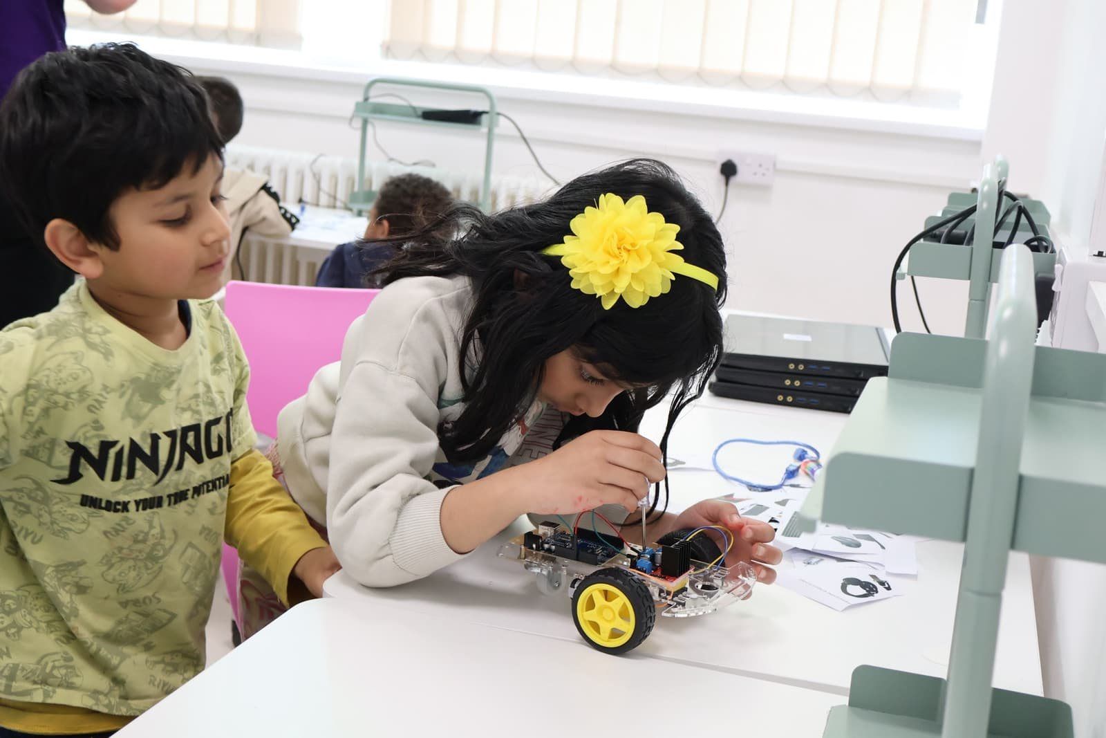 A Robocoder wiring up a robot car