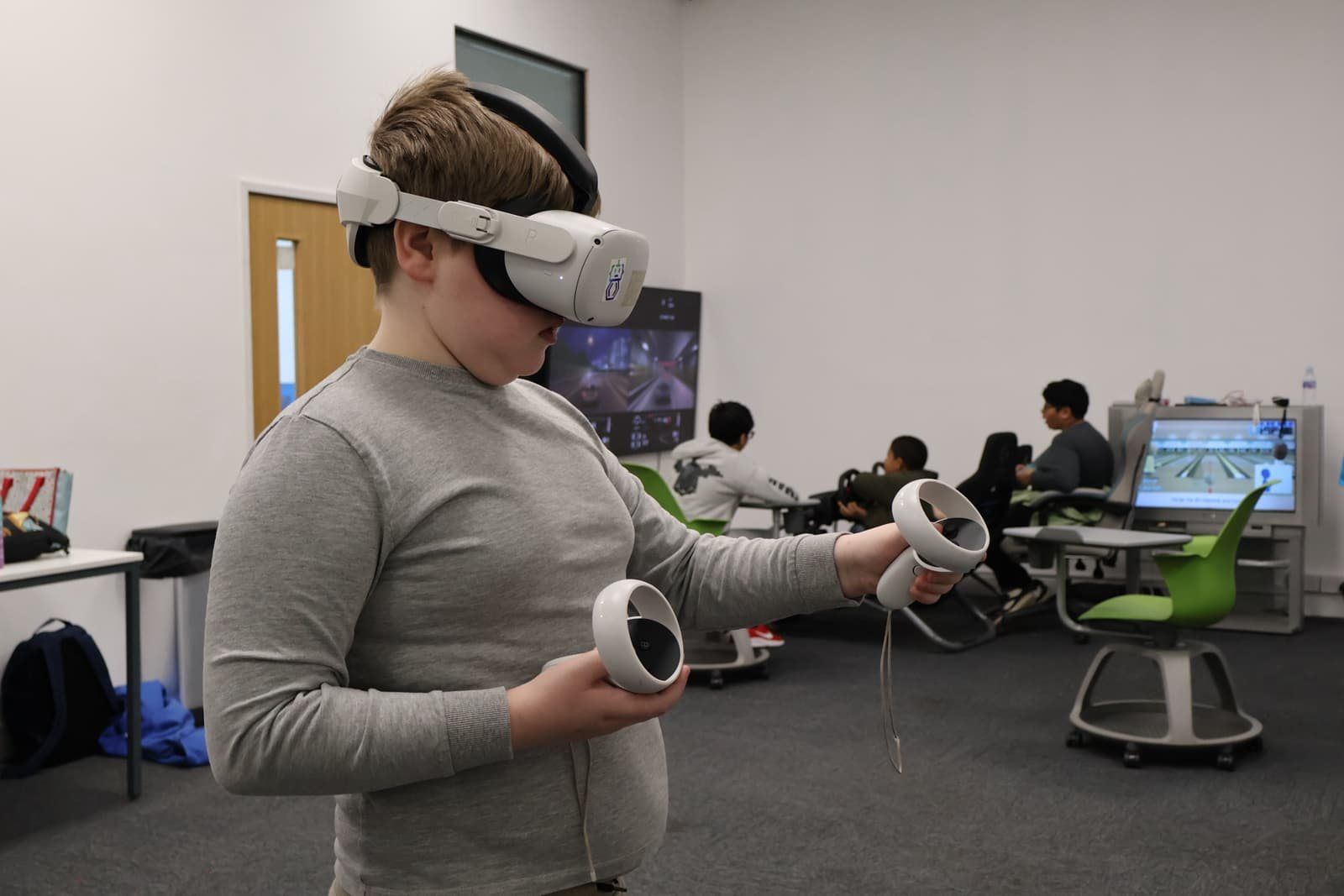 A Robocoder trying a virtual reality headset