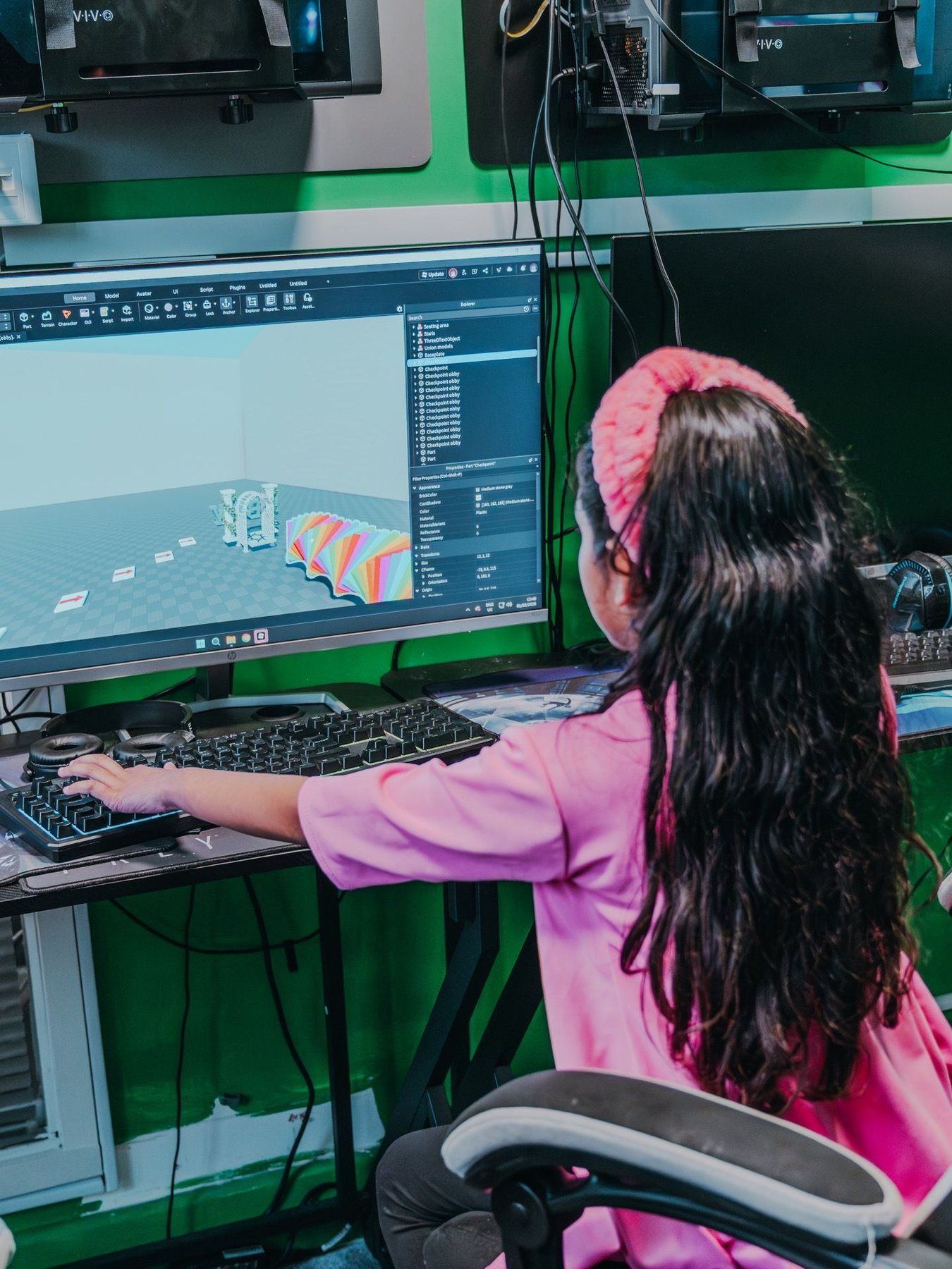 A Robocoder modelling in 3D at her computer