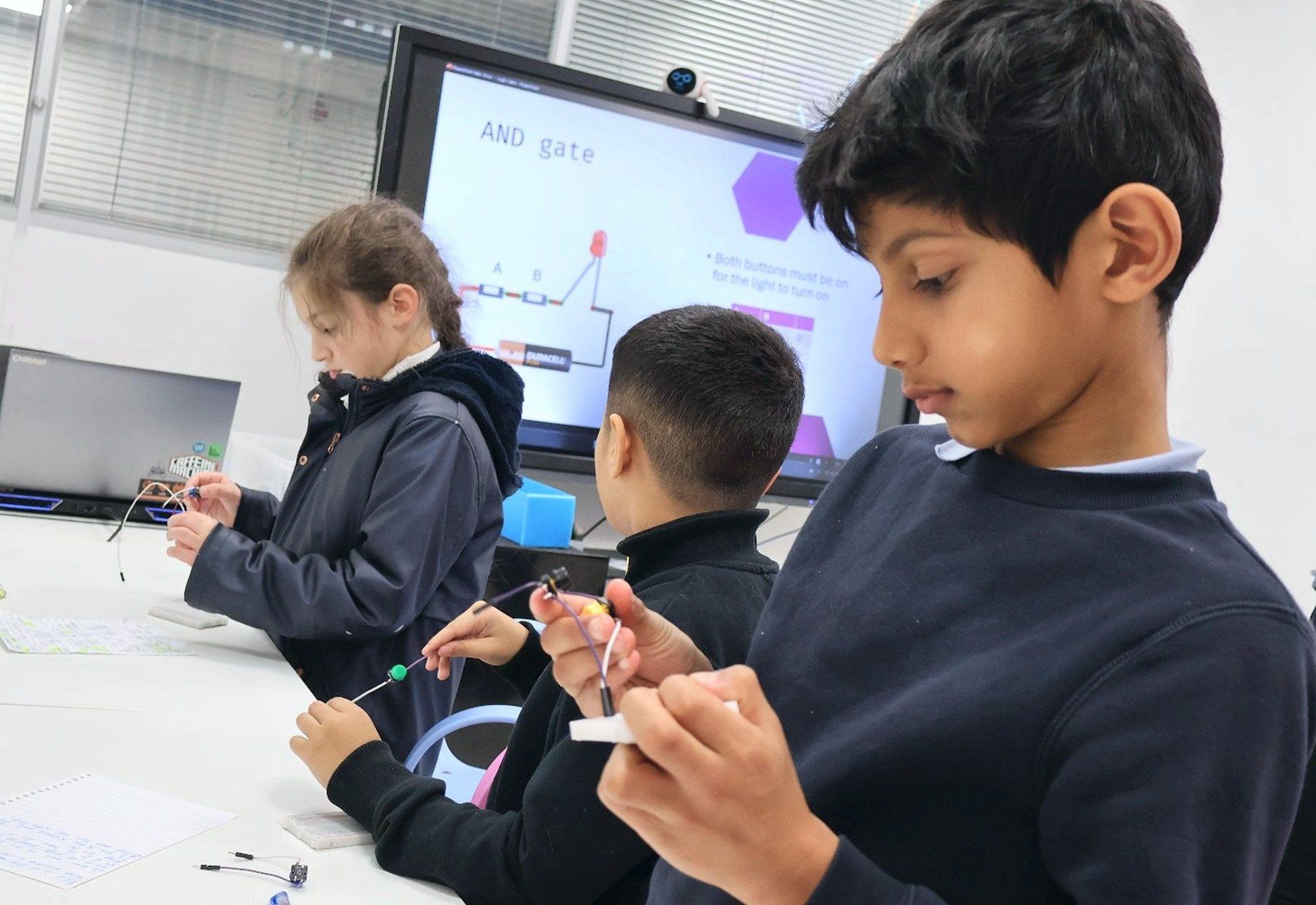 Robocoders working through logic gates in class