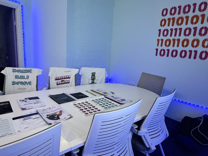 The training room set out with the franchise pack, with Robocode T-shirts over the chairs